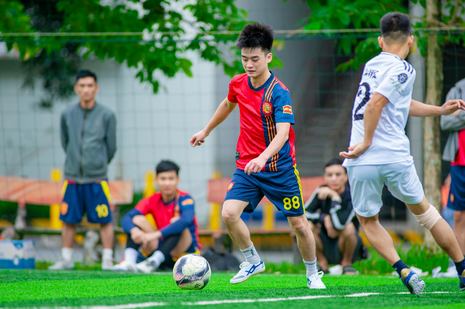 Energetic moment from a youth soccer match in Hà Nội, showcasing teamwork and enthusiasm.