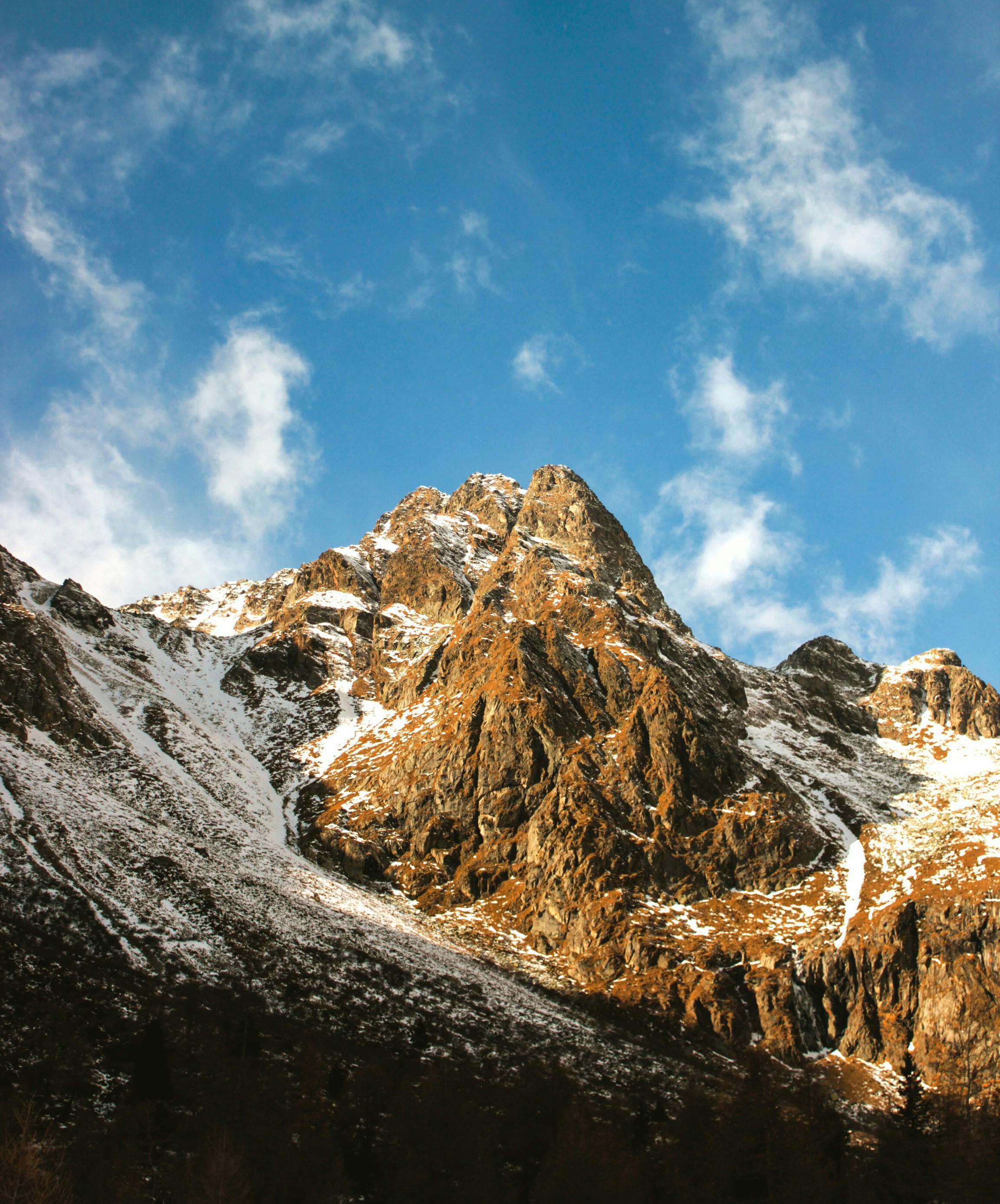 Prescription Goggle Inserts - A stunning view of a snow-covered mountain peak under a clear blue sky, ideal for nature lovers.