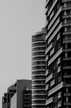 Black and white view of modern high-rise buildings showcasing urban architecture.