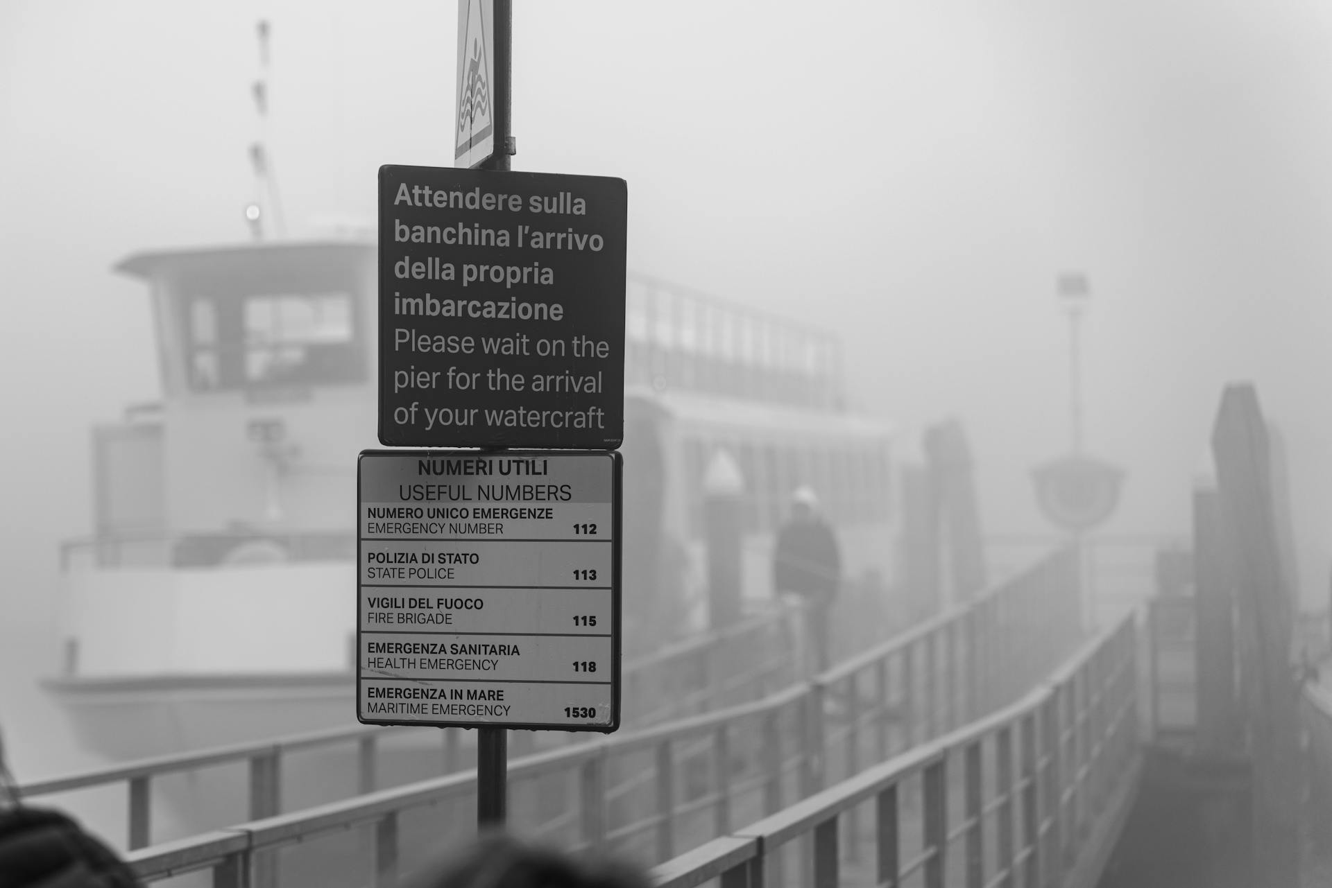 Misty view of a ferry terminal sign in Punta Sabbioni, Veneto, Italy.