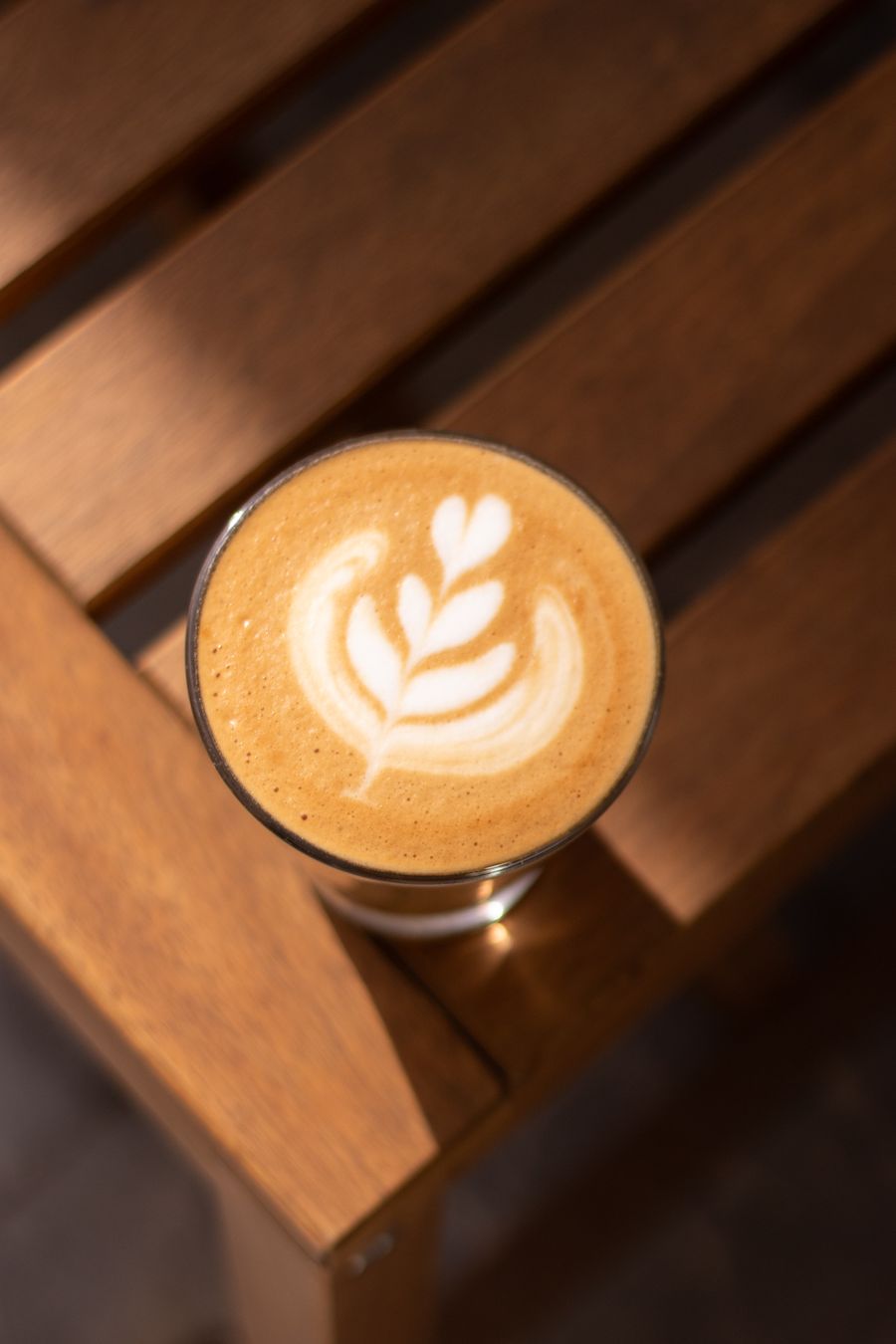 Floral latte art in a ceramic cup