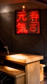 Warm and inviting Japanese restaurant interior with neon sign in Mexico City.