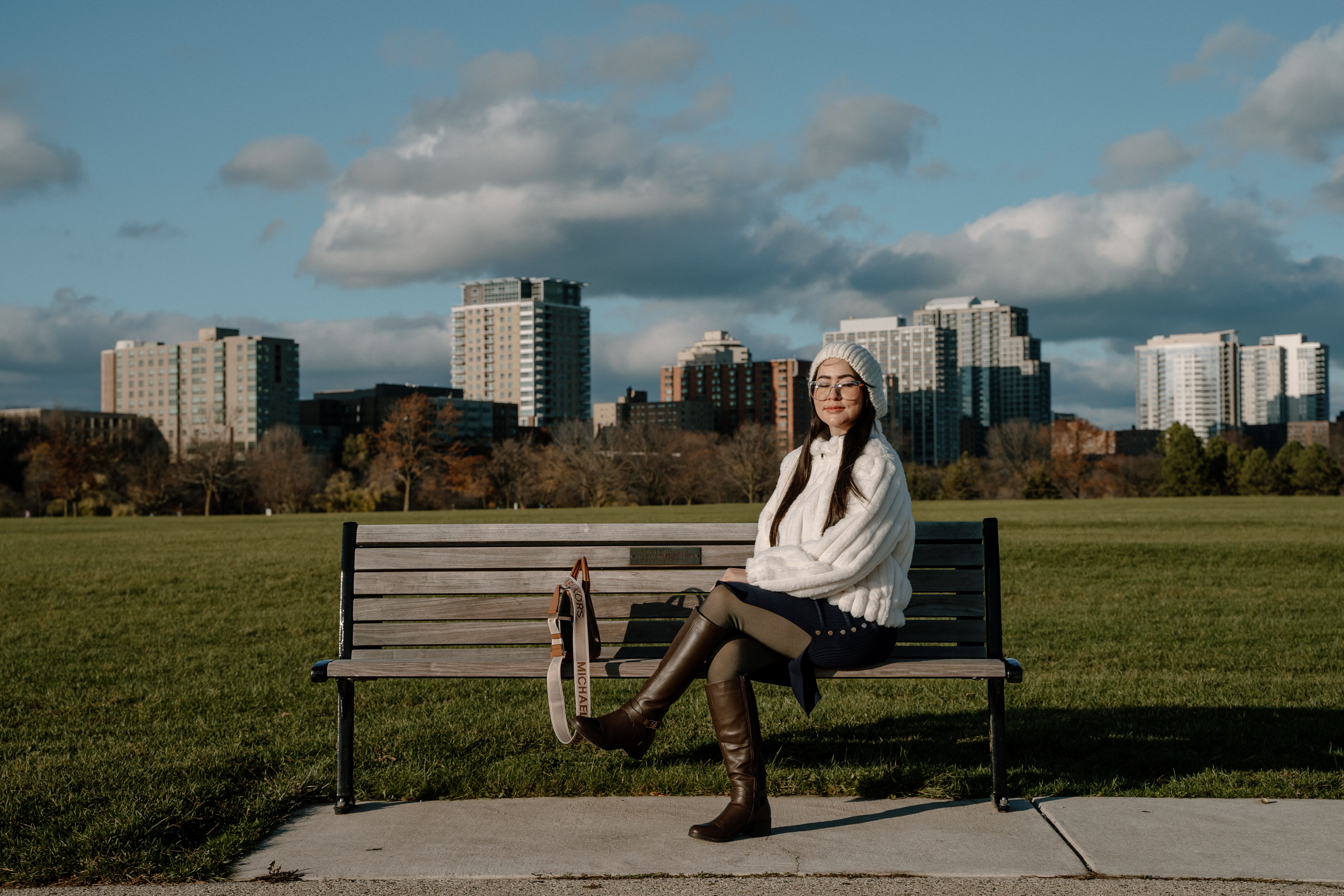 Woman Enjoying Fall Day on Milwaukee Park Bench · Free Stock Photo