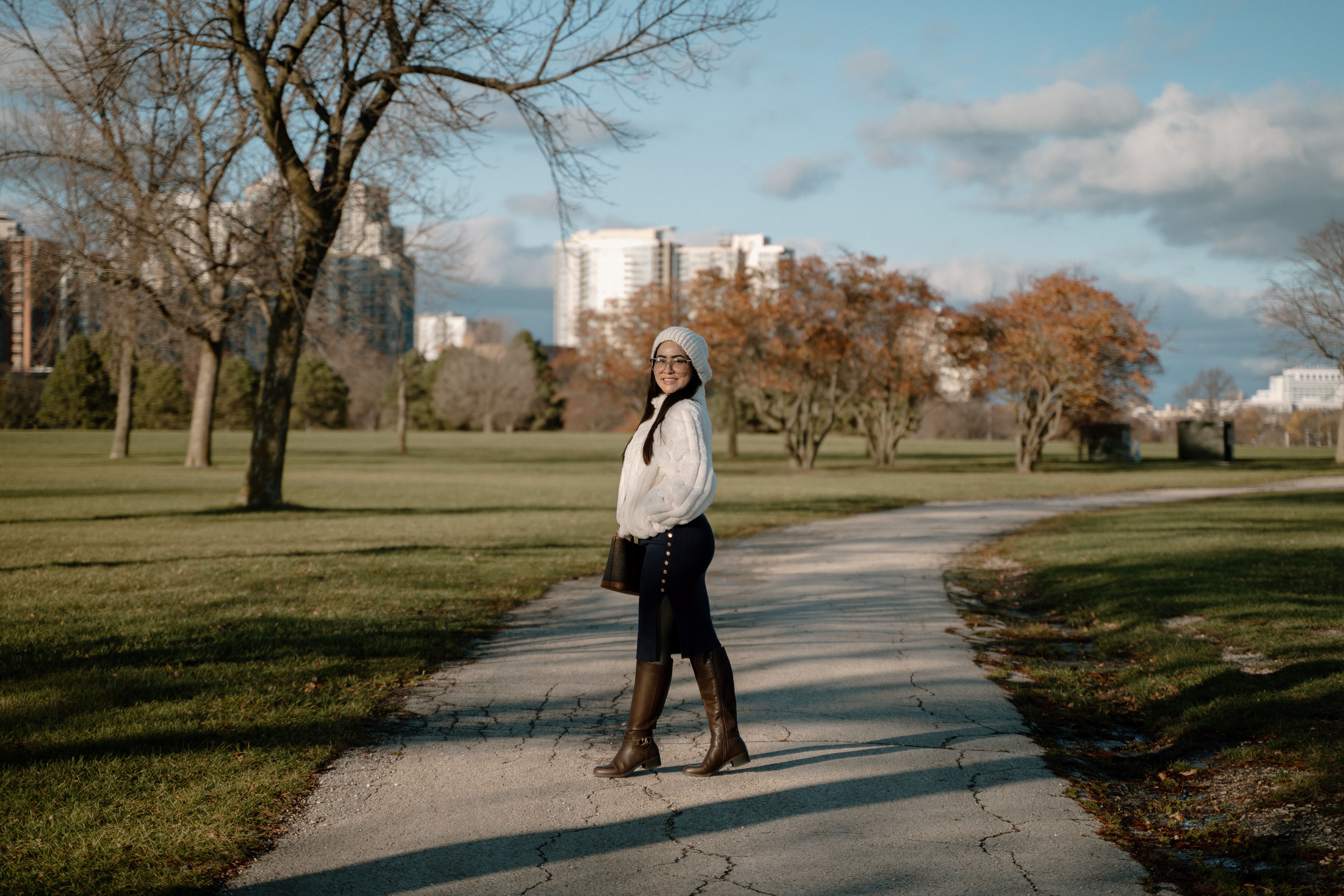 Woman Enjoying a Stroll in a Milwaukee Park · Free Stock Photo