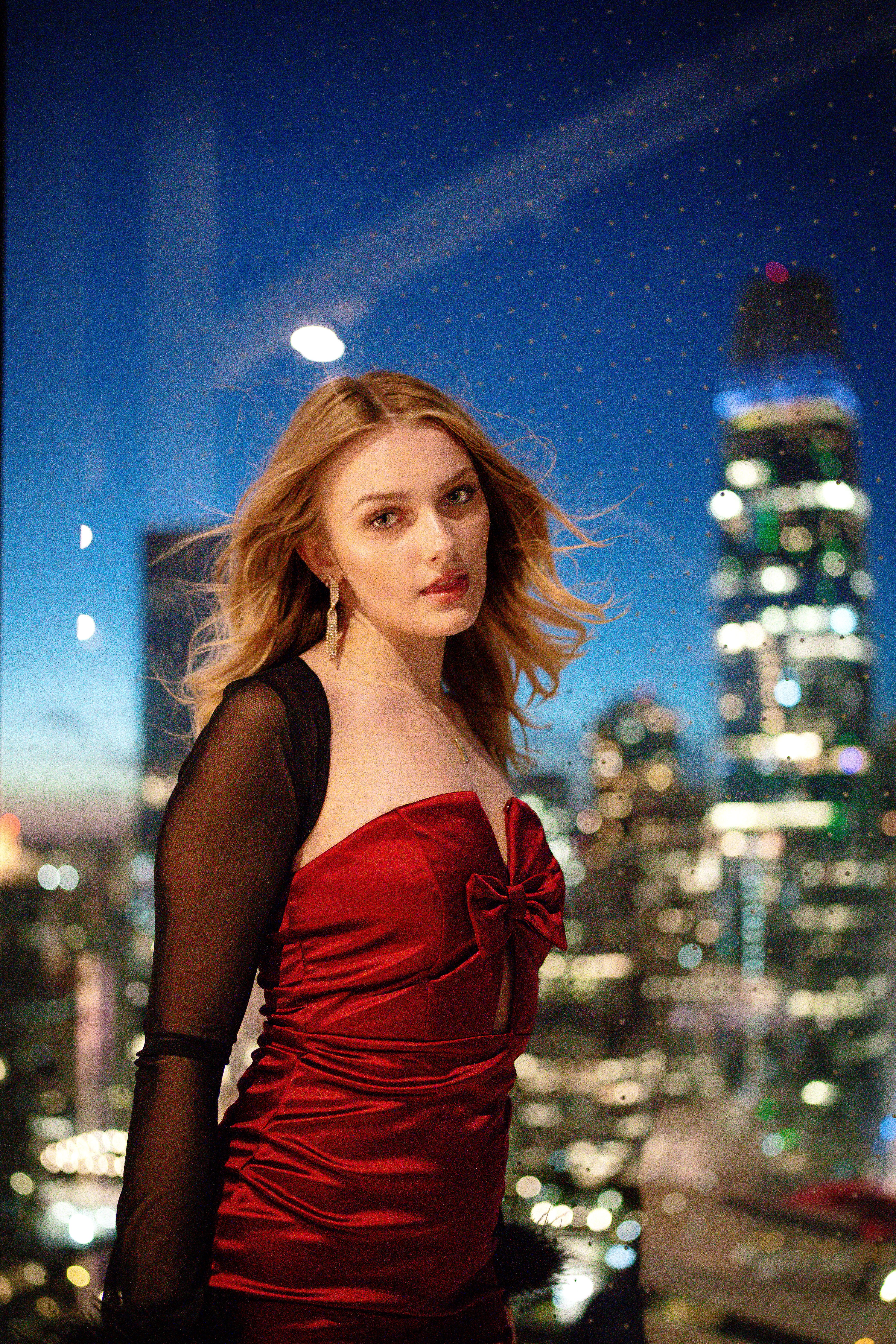 Elegant Woman in Red Dress at Night Cityscape · Free Stock Photo
