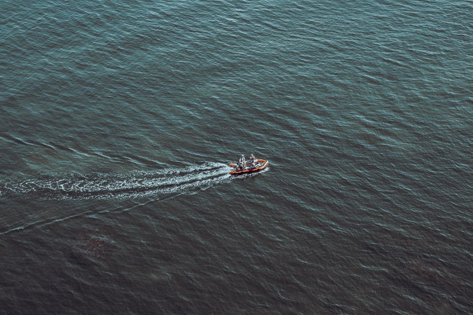 Aerial view of a speedboat racing across the Gulf of St. Lawrence near Gaspé, Québec.