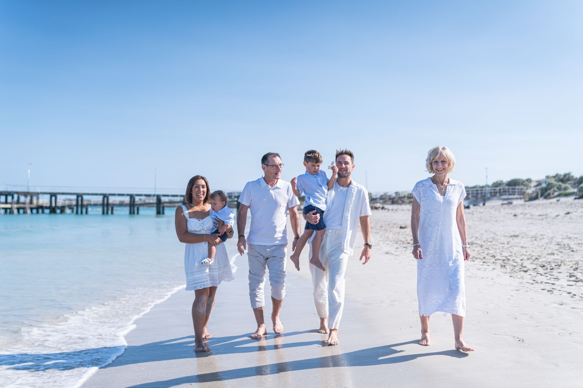 Three generations enjoying a holiday together at a seaside resort