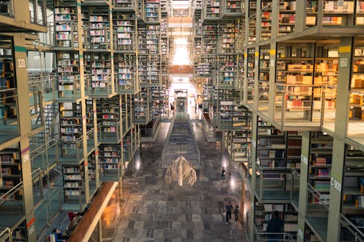 Spacious interior of Biblioteca Vasconcelos with towering bookshelves and modern architecture.