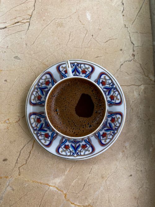 Free Close-up of rich Turkish coffee in a colorful, patterned espresso cup, perfect for coffee lovers. Stock Photo