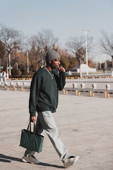 Urban fashion model walking briskly in a stylish outfit through the streets of Shanghai.