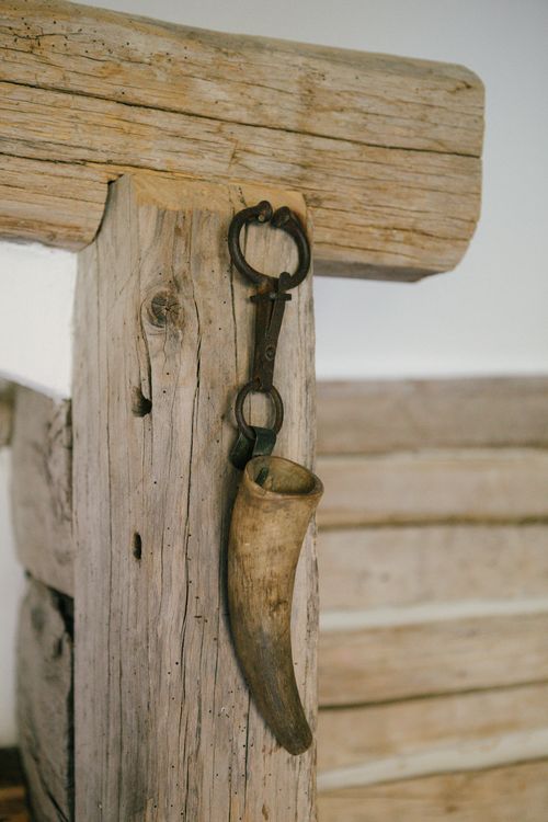 Free A rustic wooden structure showcasing a traditional horn decor in a minimalist setting. Stock Photo