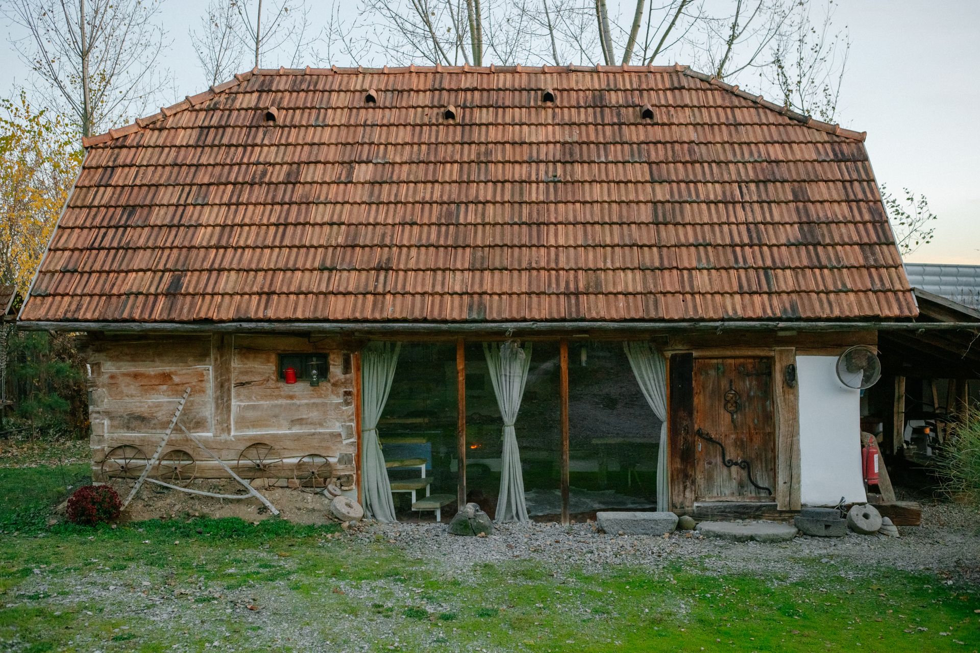 Charming rustic wooden cabin with pitched roof in a serene natural setting.