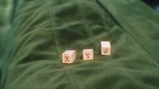 Wooden Alphabet Blocks on Green Fabric