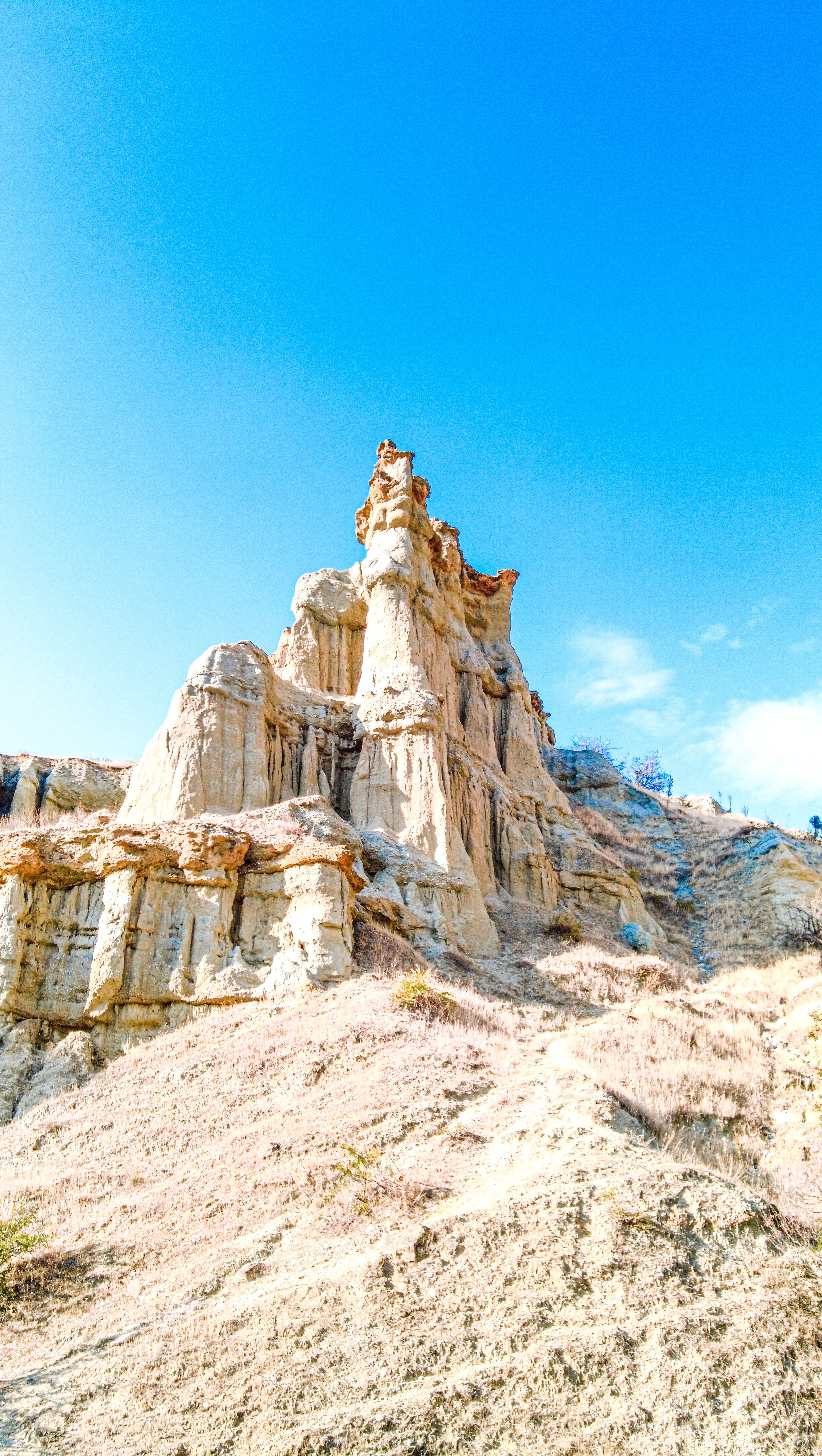 Majestic Rock Formation Under Clear Blue Sky · Free Stock Photo