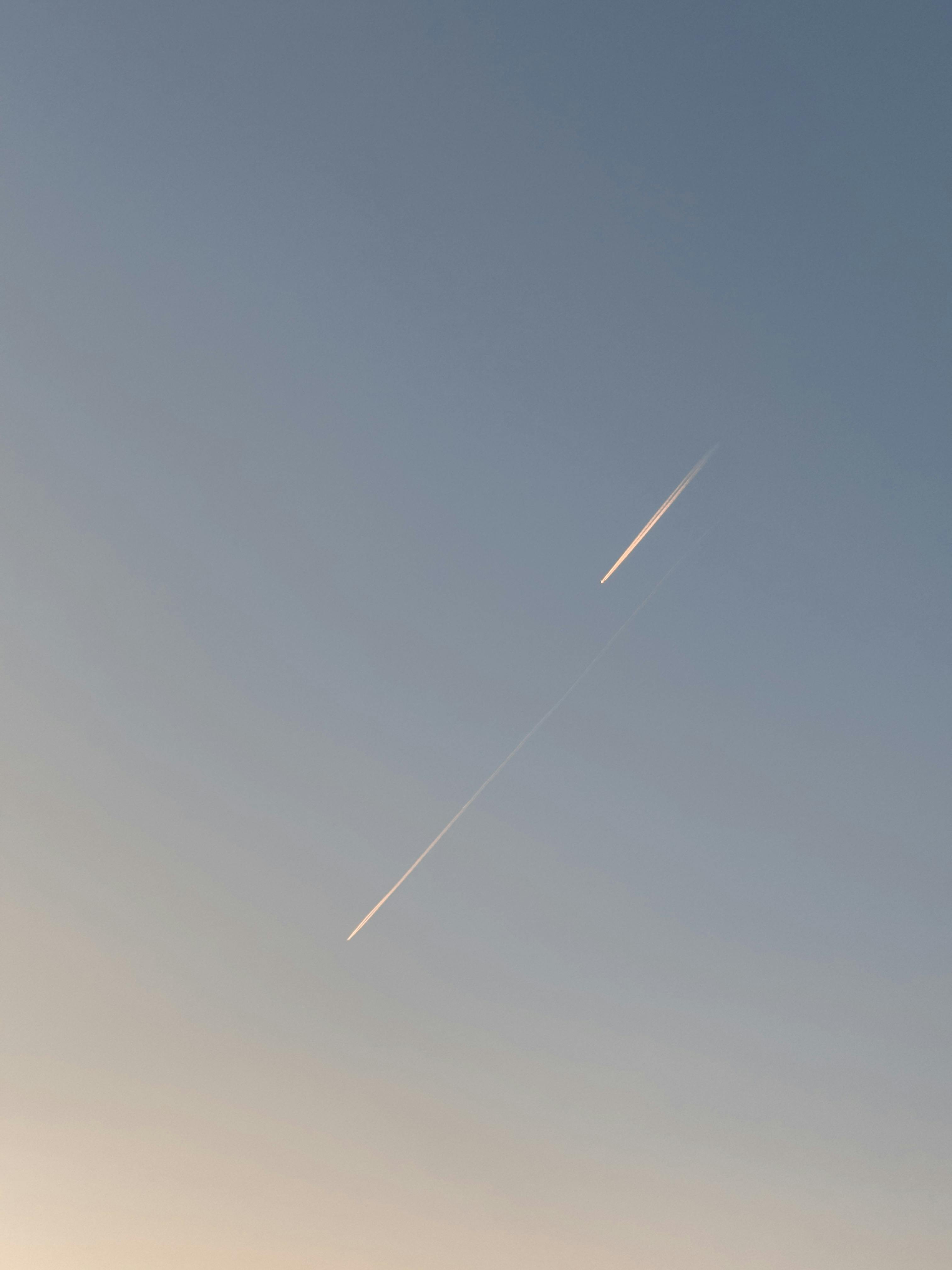A striking airplane contrail captured against Baku's serene blue sky.