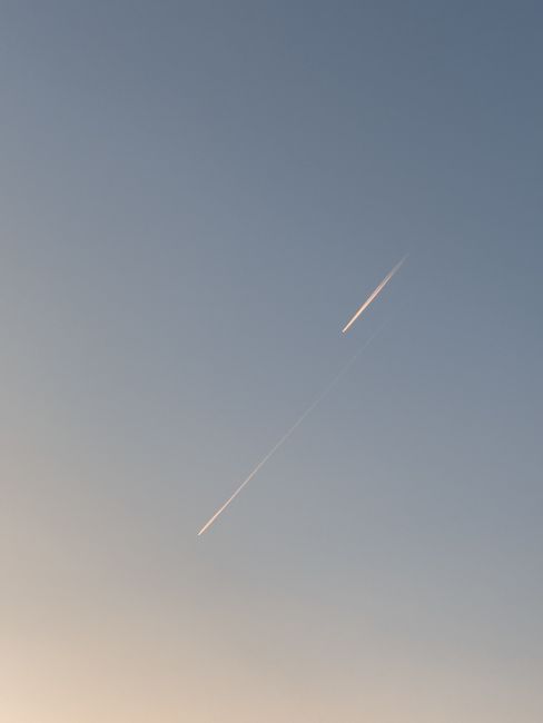 A striking airplane contrail captured against Baku's serene blue sky.
