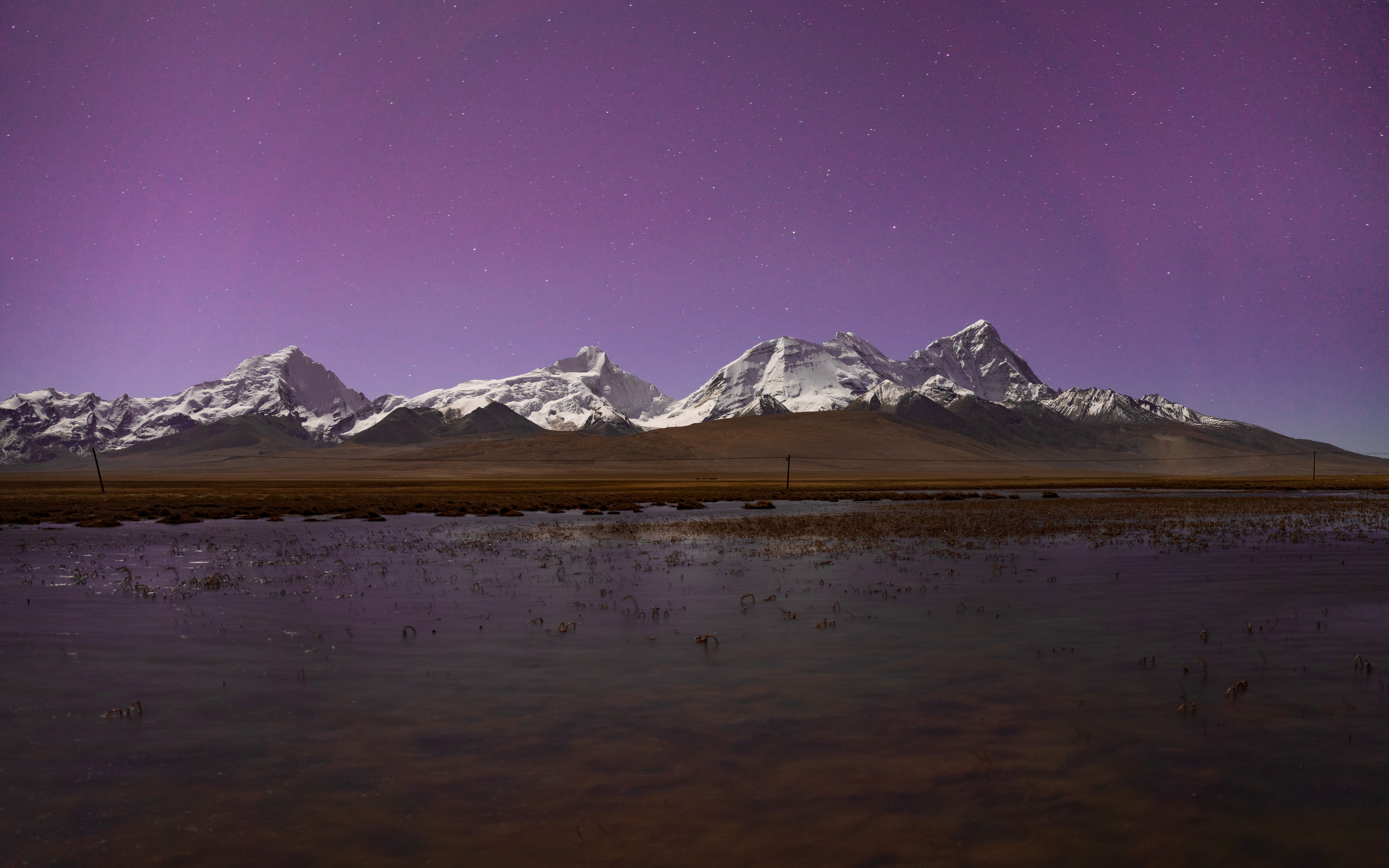 Stunning Night Sky Over Snow-Capped Mountain Range · Free Stock Photo