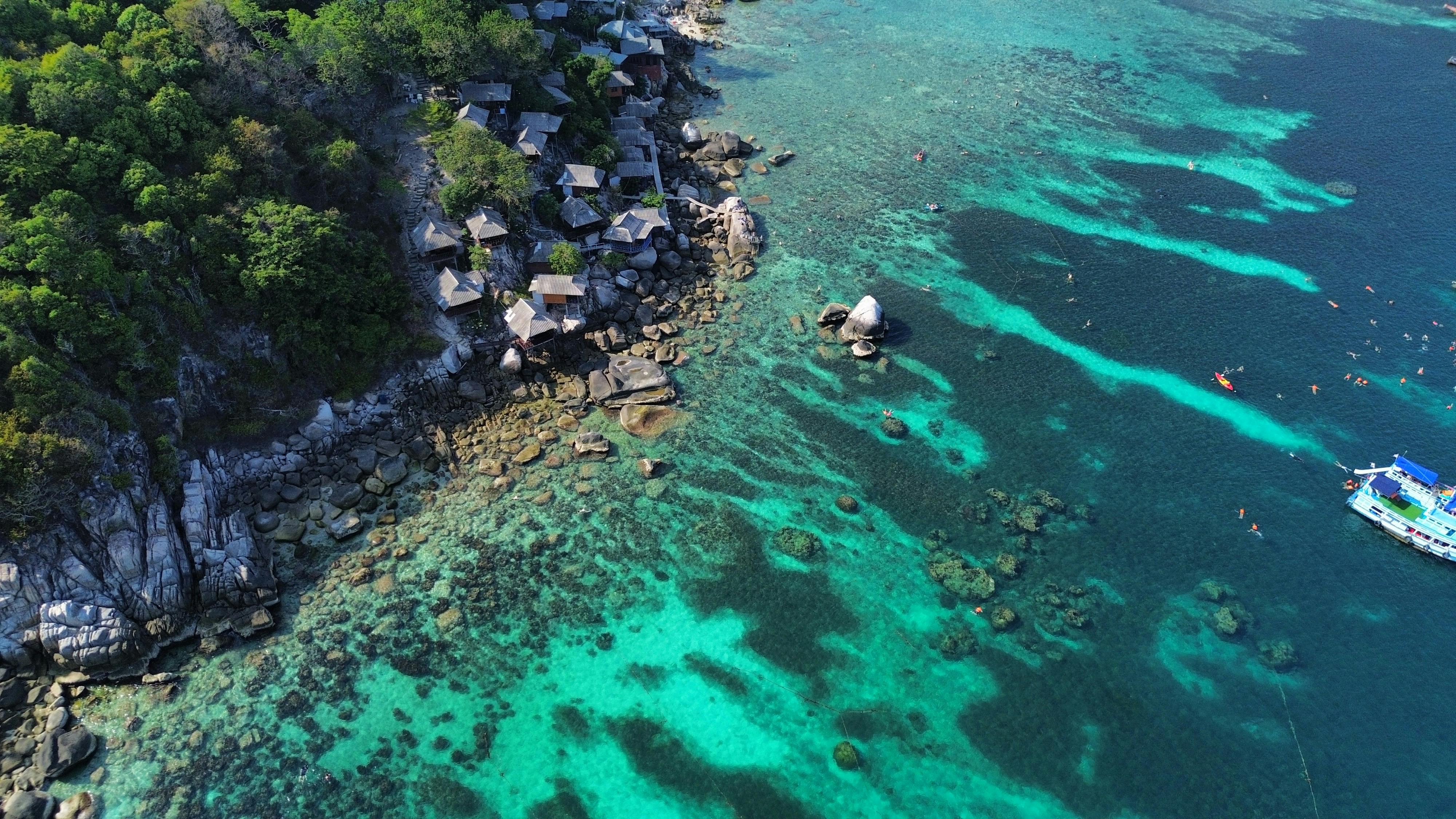 Discover the breathtaking beauty of Shark Bay's turquoise waters and rocky coastline in Ko Tao, Thailand.