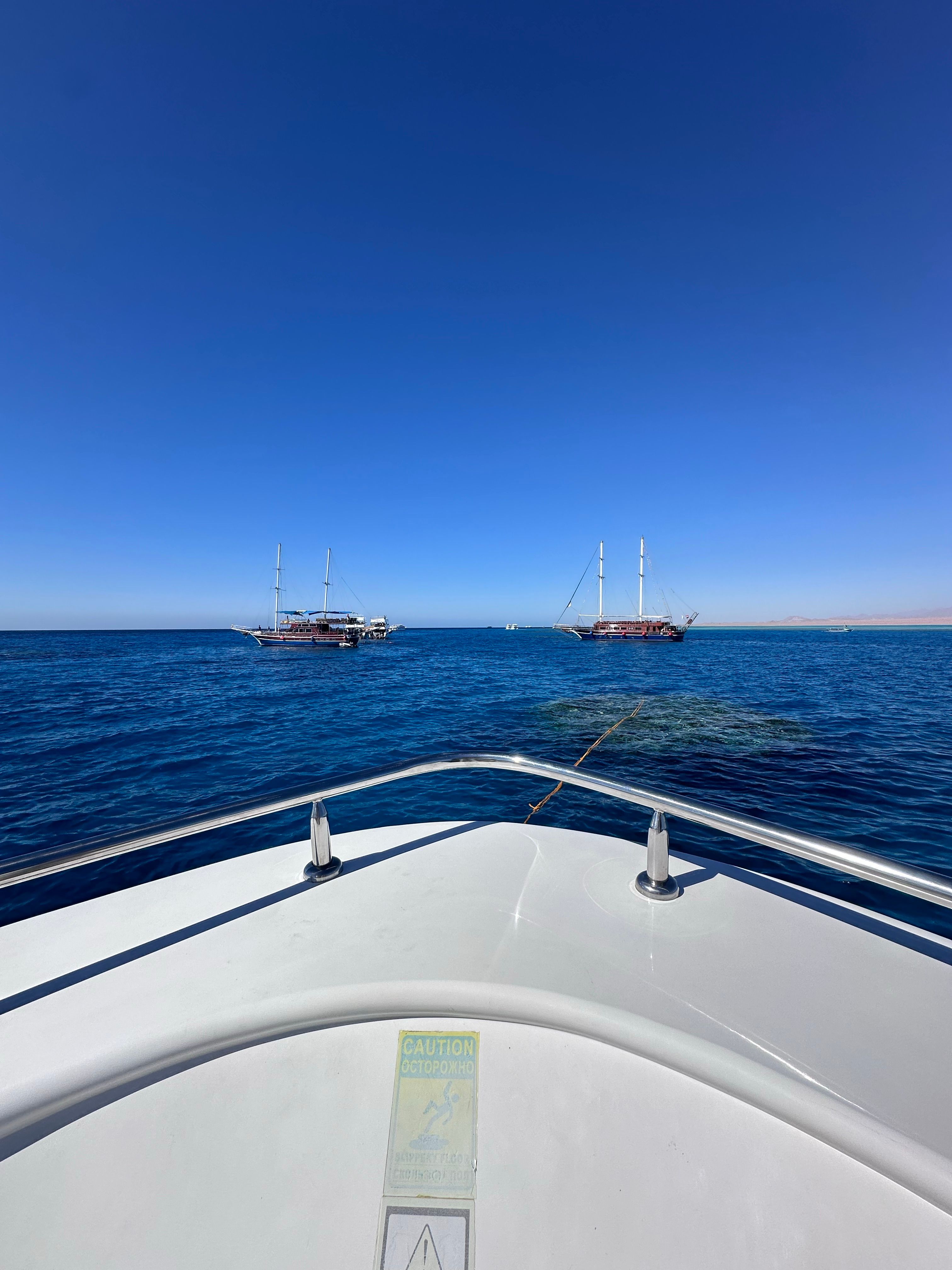 Serene Boat Ride on Clear Blue Ocean Waters · Free Stock Photo