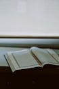 Open Book on a Table by Window Lighting