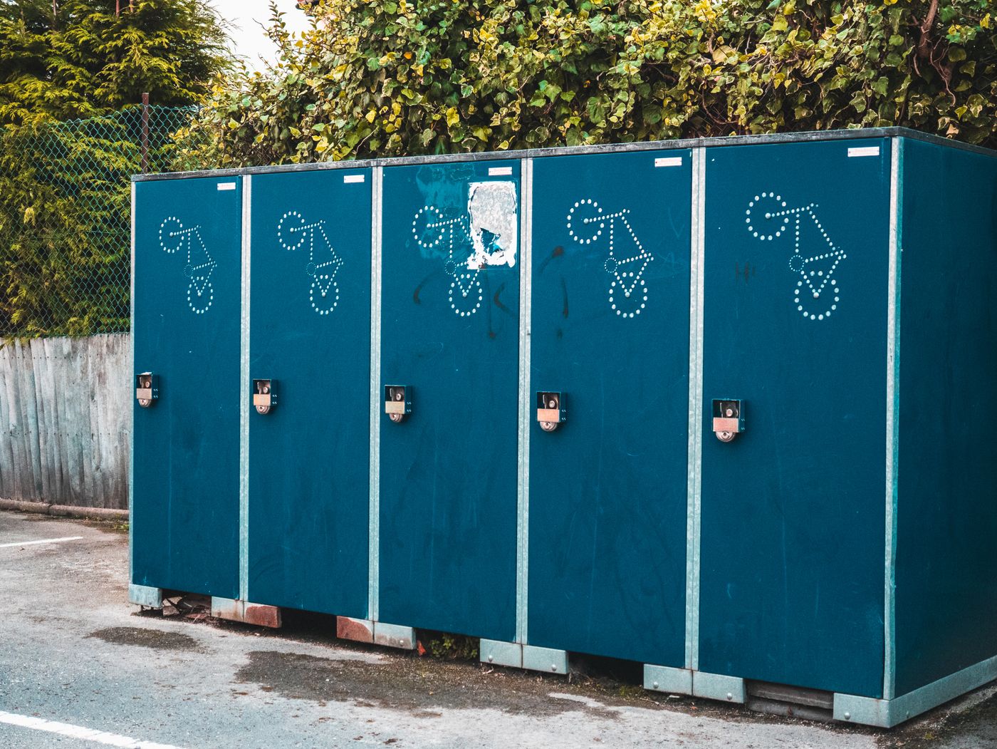Row of accessible portable restrooms lined up outdoors