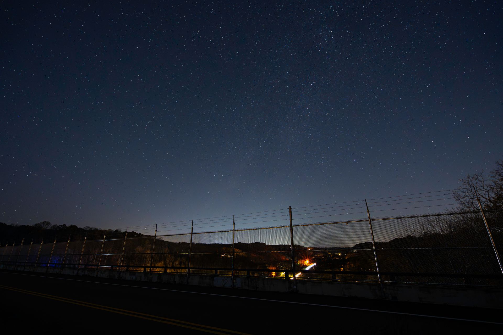 A serene night sky with stars over a bridge in Nashville, Tennessee.