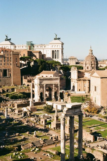 Capture of the historic Roman Forum in Rome, showcasing ancient ruins under a bright sky.
