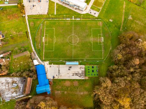 Drone shot of a football field surrounded by trees in Garešnica, Croatia.