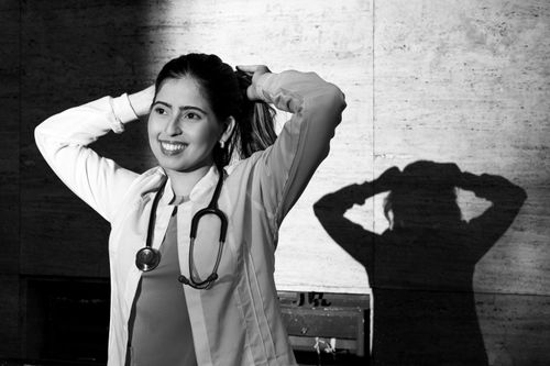 Free Monochrome portrait of a smiling female doctor with a stethoscope, captured in Buenos Aires. Stock Photo