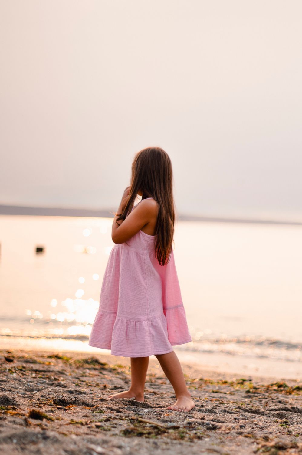 Young Girl in Pink Dress by the Beach · Free Stock Photo