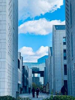 Explore modern architecture between skyscrapers in Tianjin's urban landscape.