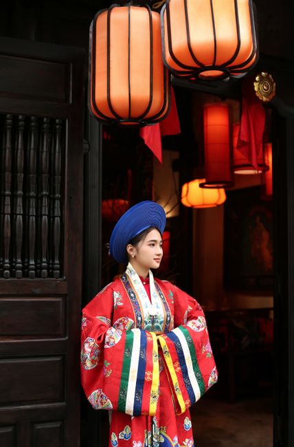 A woman in traditional Vietnamese attire in Hội An, Vietnam.