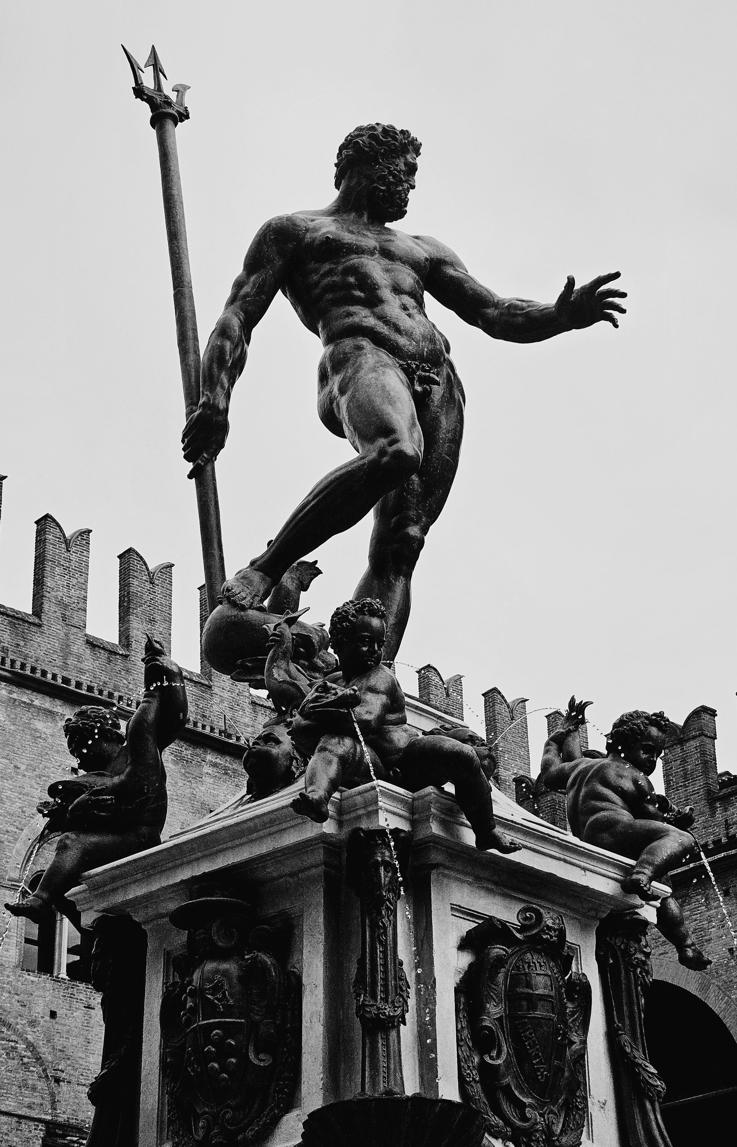 Classic black and white image of the Neptune Fountain in Bologna, Italy.