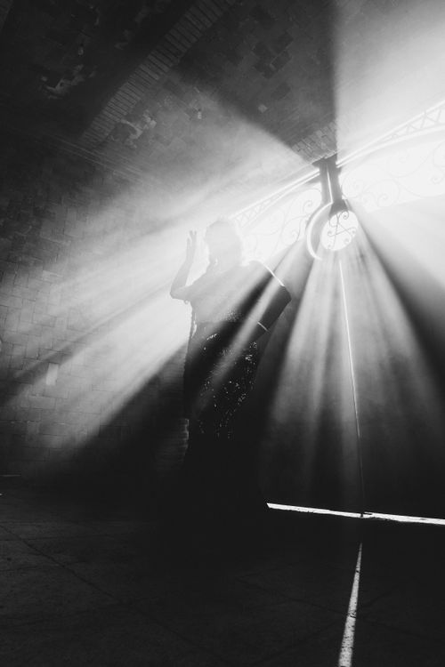 Free A captivating silhouette of a woman with dramatic lighting in an architectural interior, Mexico City. Stock Photo