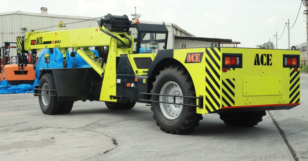 ACE TX 150 crane positioned at an outdoor construction site in Faridabad, Haryana, India.