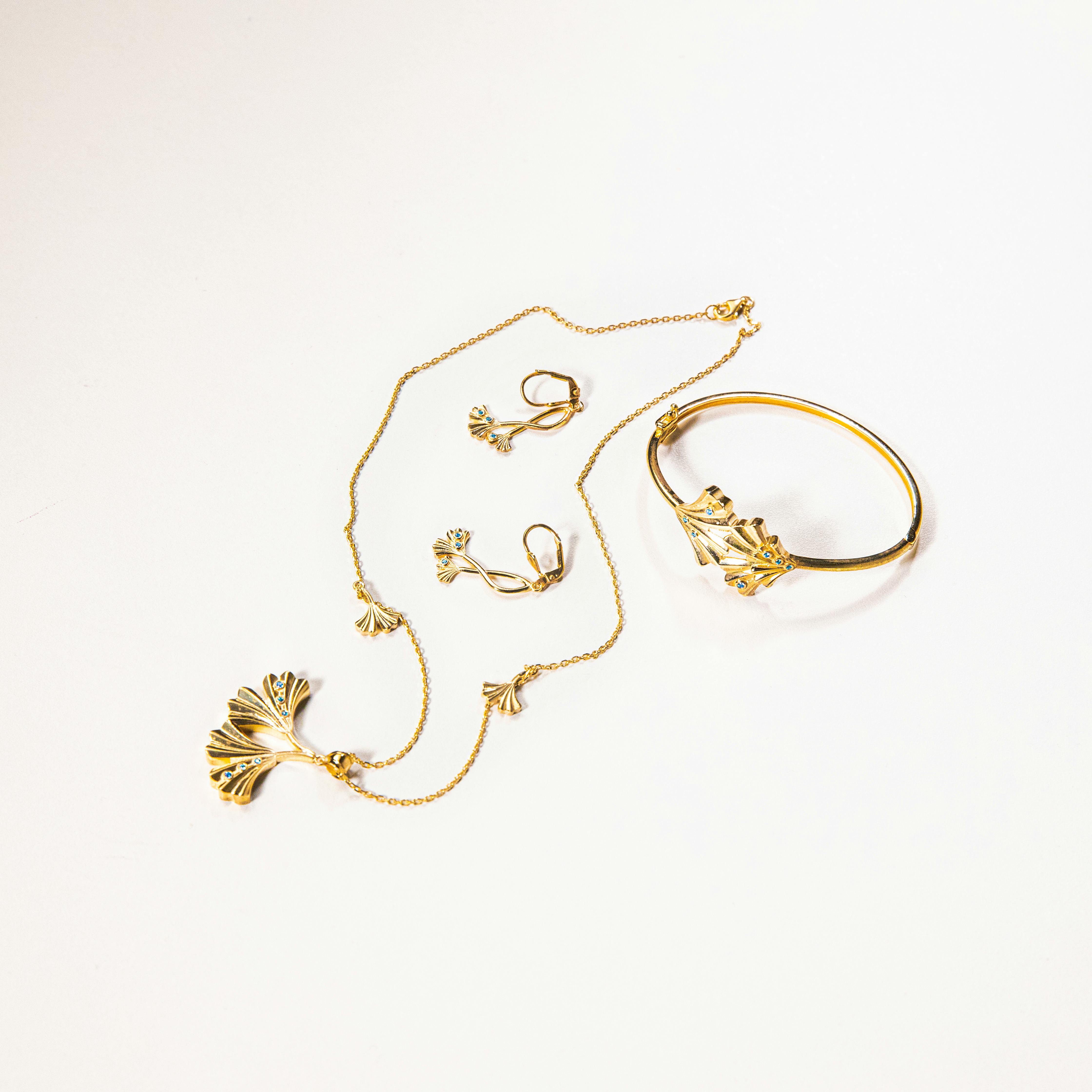 elegant gold jewelry set with leaf design