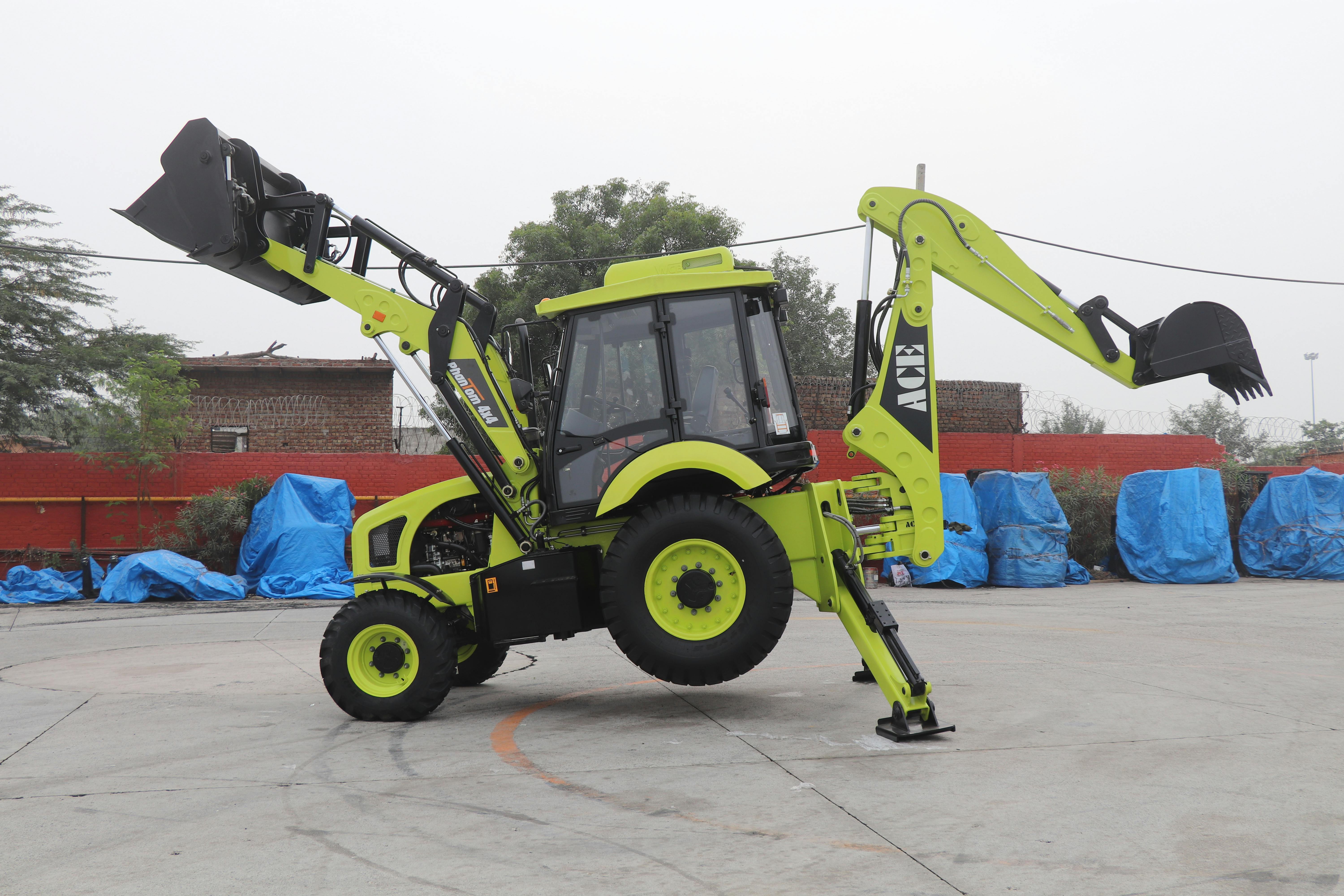 ACE Phantom backhoe loader displayed outdoors in Faridabad, India.