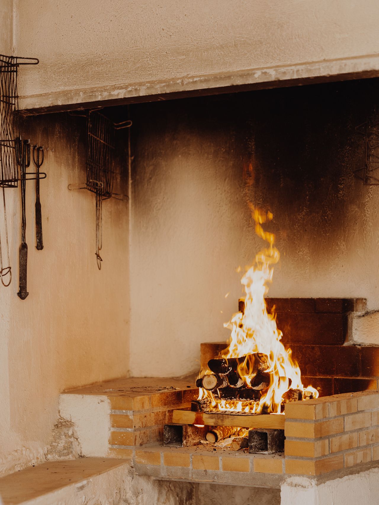 Flames burning inside a brick firebox showing heat-resistant firebrick