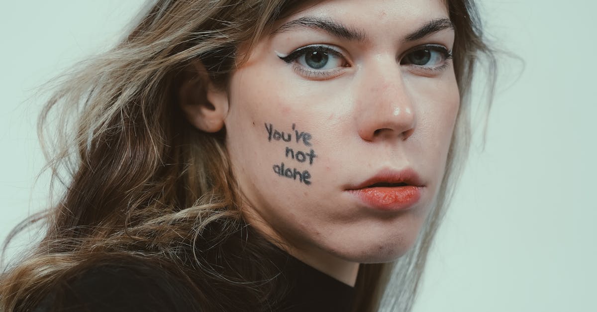 Close-up portrait highlighting mental health awareness with 'You're not alone' message.