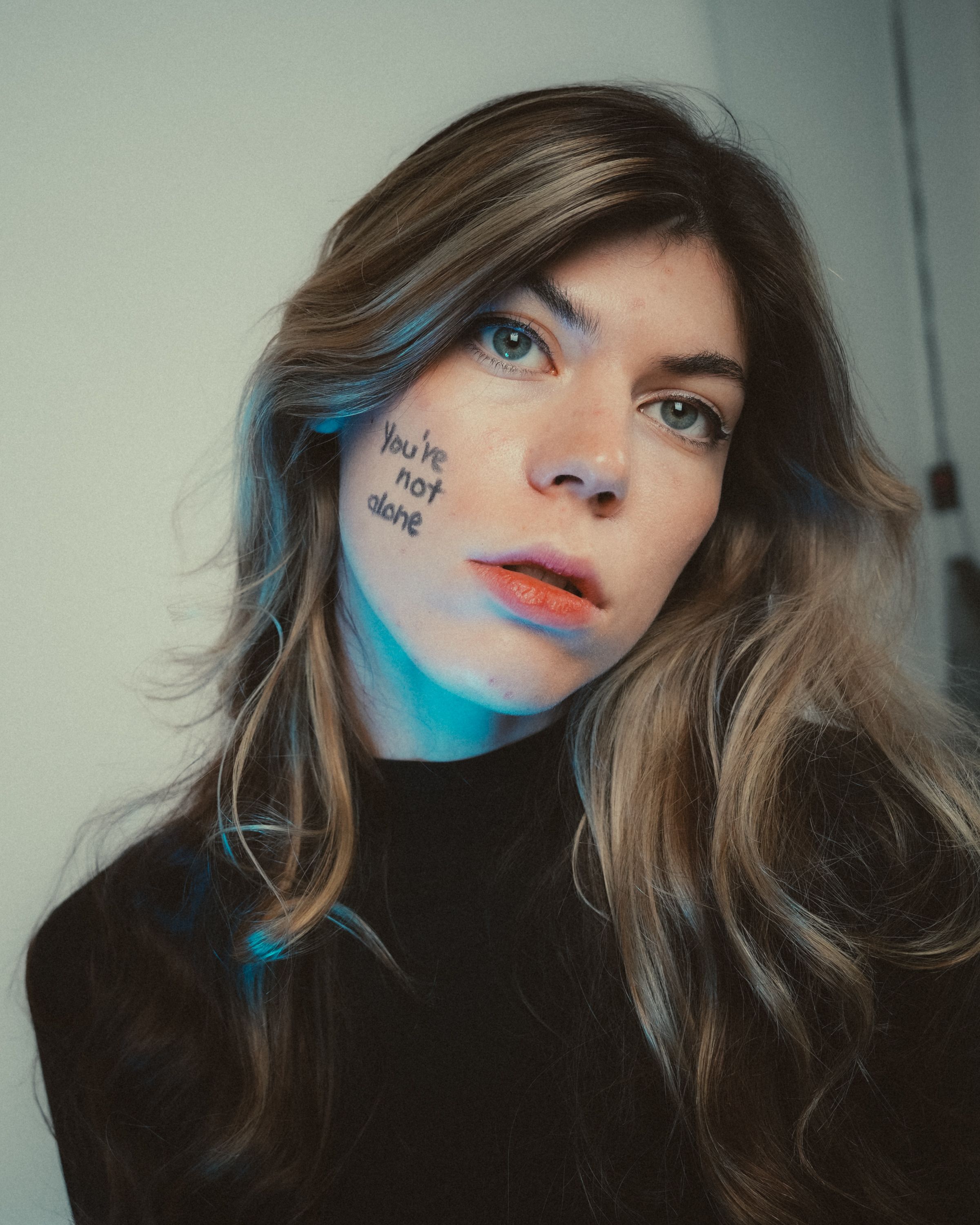 Emotive Portrait with Message of Support · Free Stock Photo