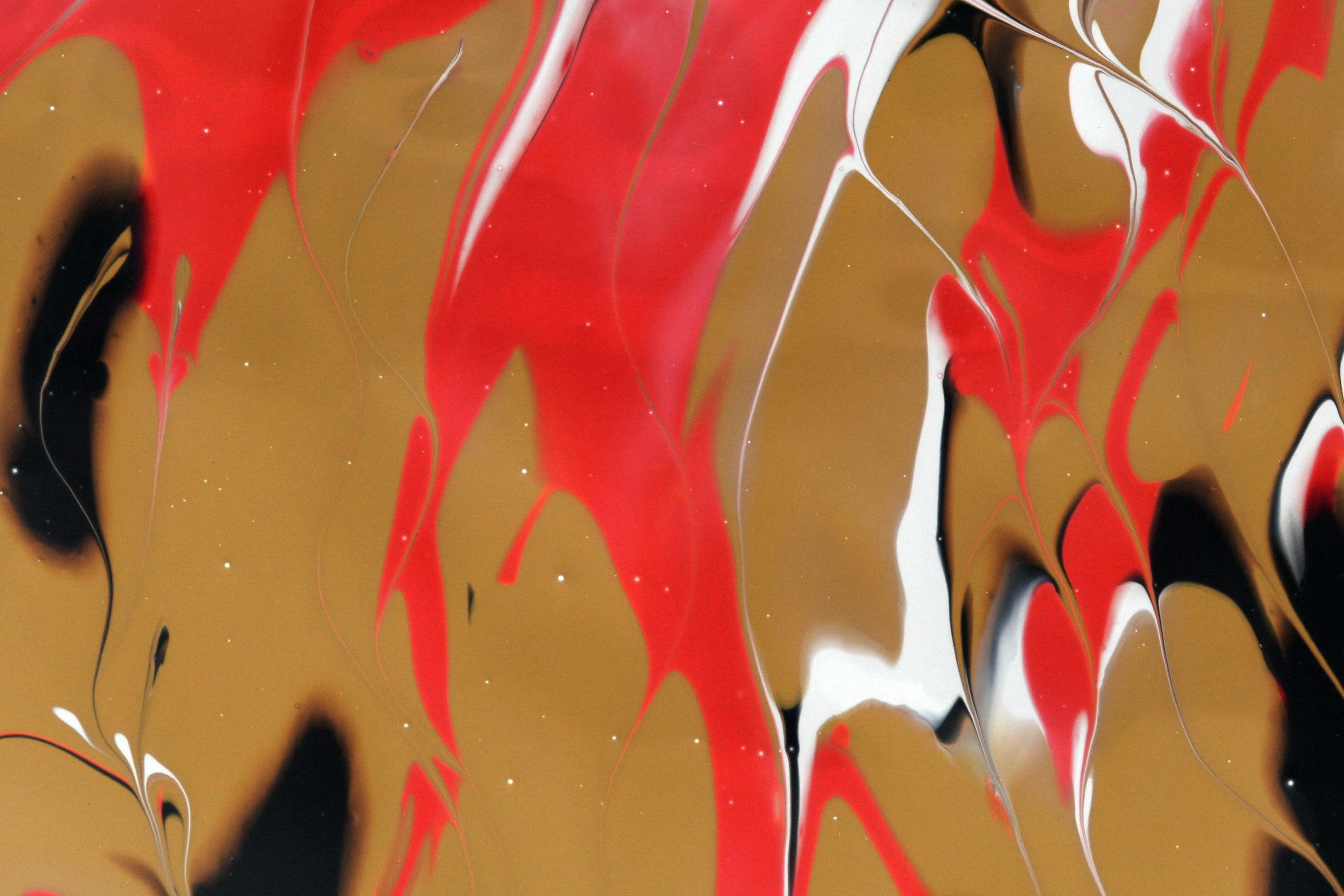 vibrant abstract art with red and gold swirls