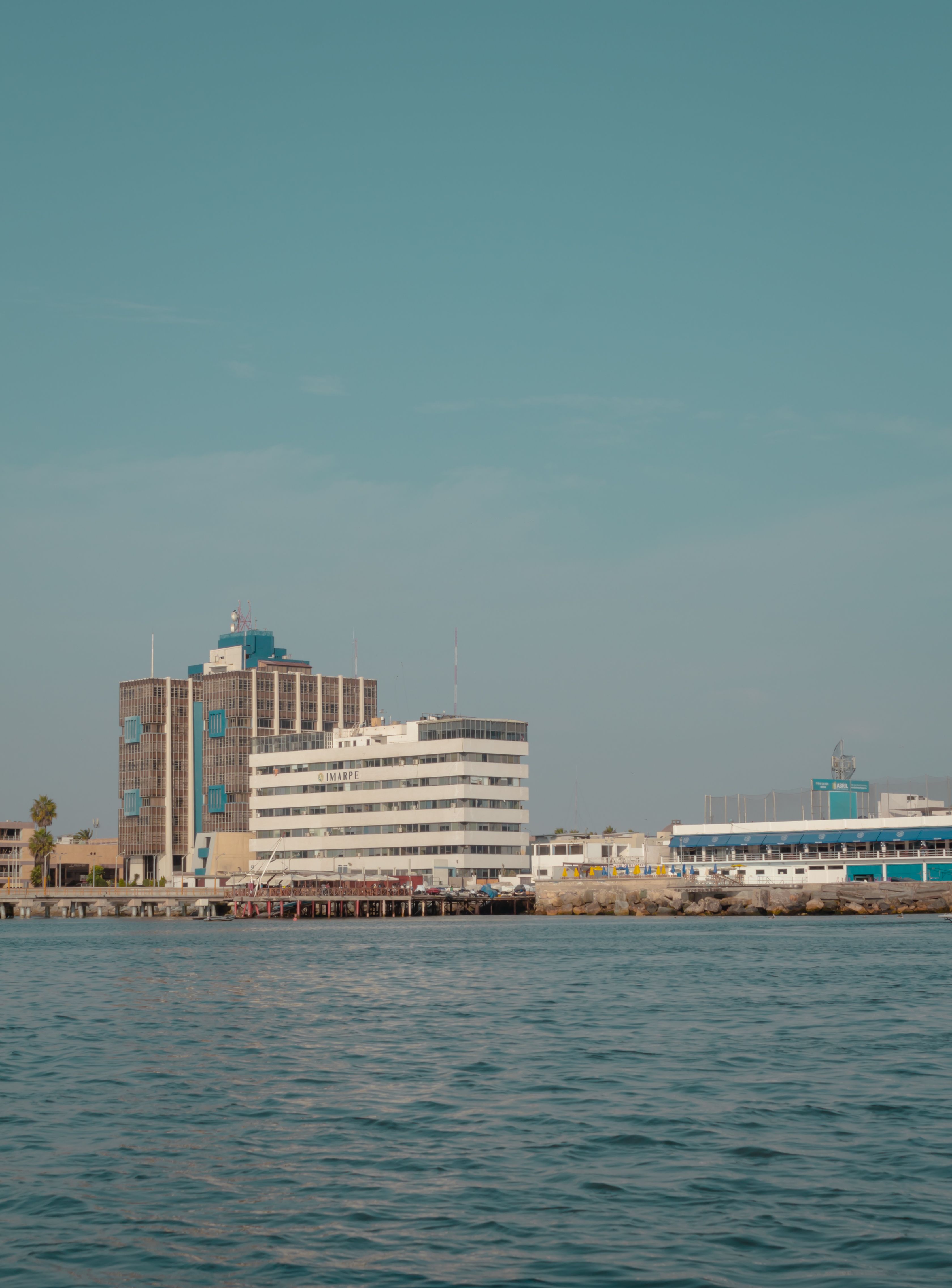 Image showcasing Scenic Waterfront View of Marina Buildings · Free Stock Photo