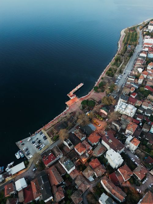 Free Stunning aerial view of a Turkish coastal town and lake, showcasing urban landscape and tranquil water. Stock Photo