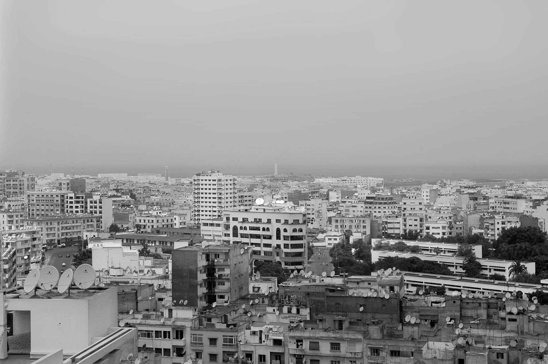 Black and white aerial view of Casablanca cityscape with buildings and skyline.