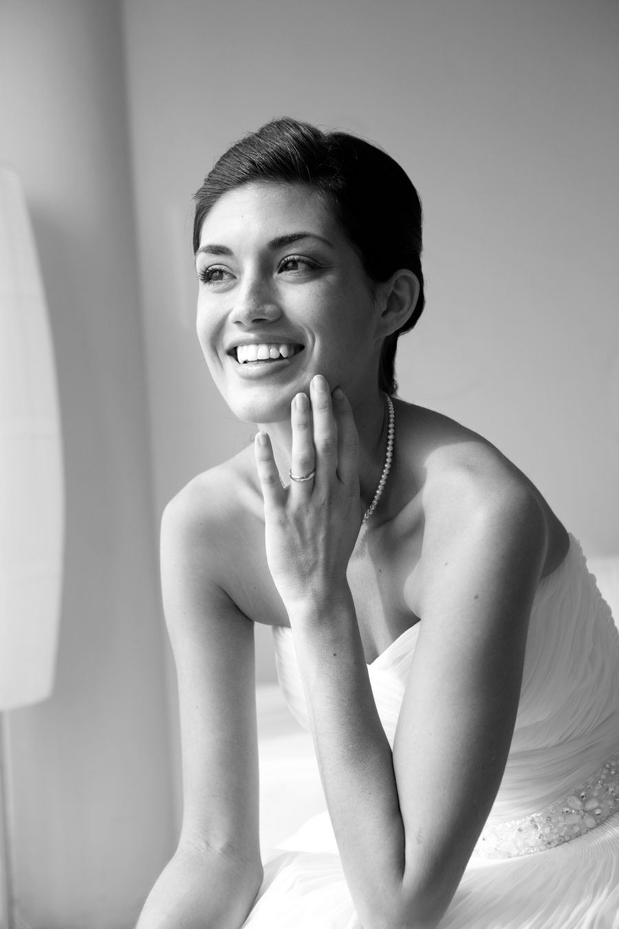 Black and white portrait of a smiling bride