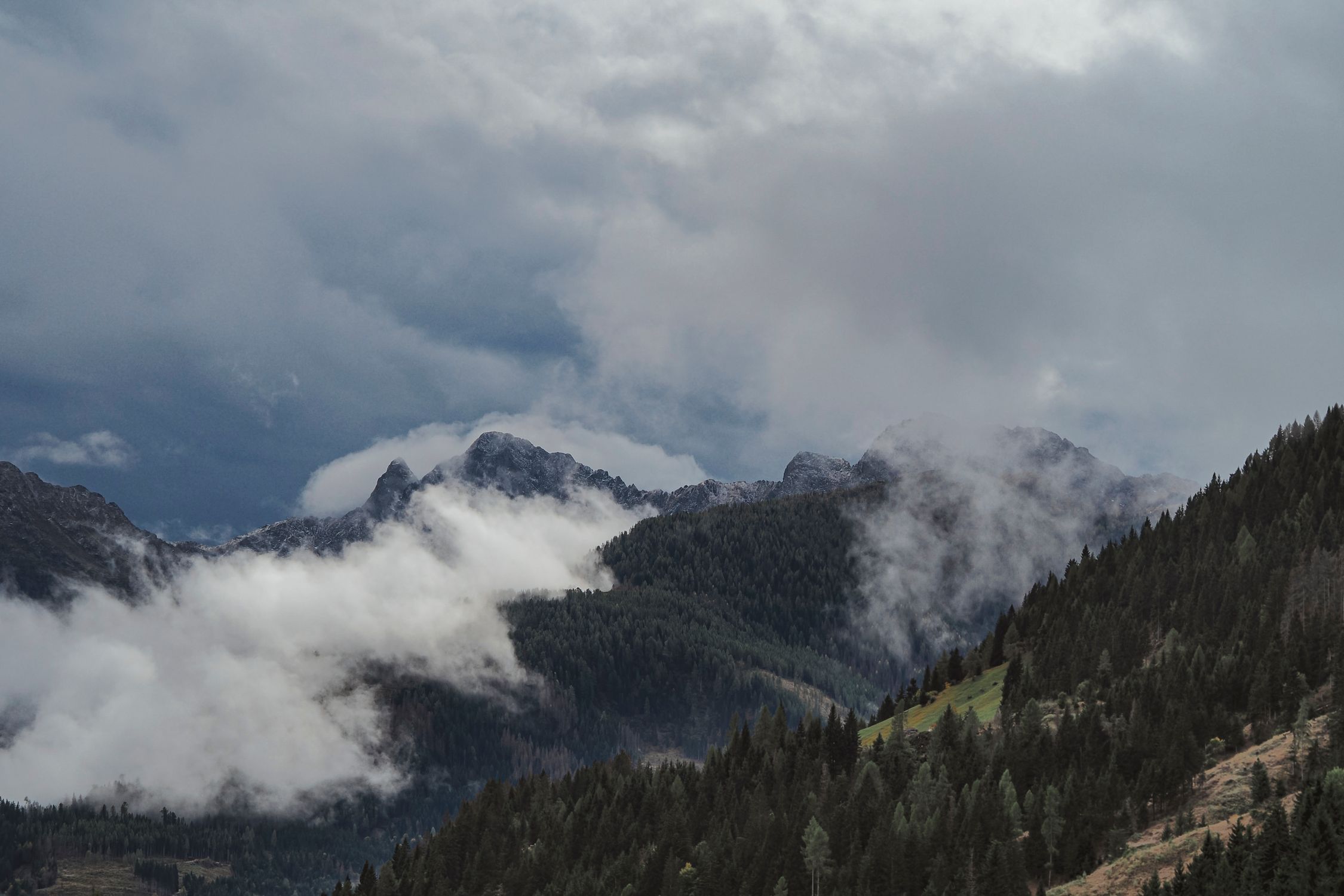 Majestic Mountain Range with Misty Clouds · Free Stock Photo