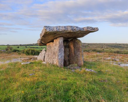 Explore the ancient Poulnabrone Dolmen in County Clare, Ireland's lush scenery.