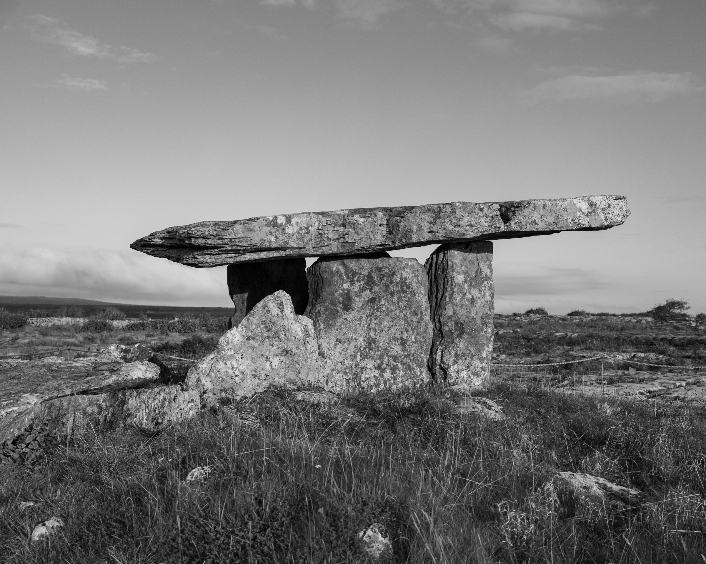 Black and white photo of Poulnabrone Dolmen in County Clare, Ireland