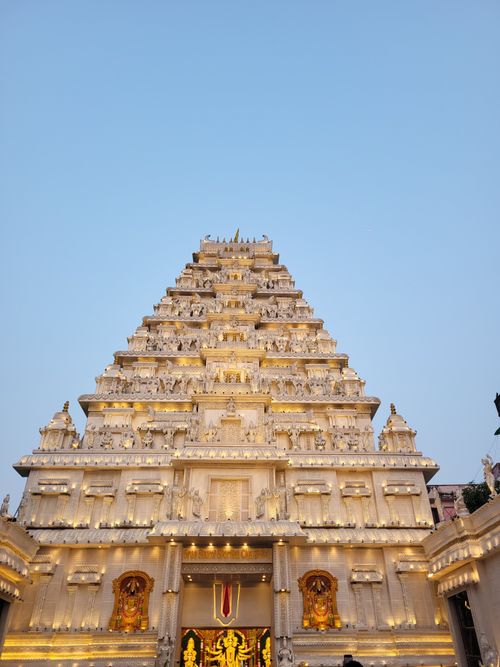 Free Beautifully lit Hindu temple in Kolkata displaying intricate architecture against a clear evening sky. Stock Photo