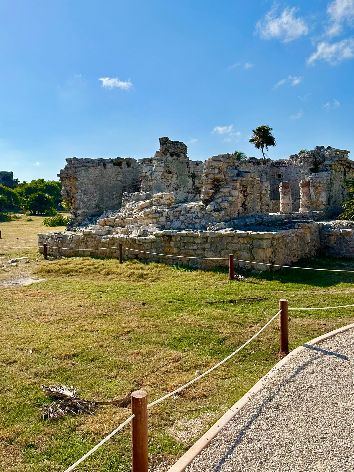Ancient Mayan ruins standing under a clear blue sky in Tulum